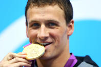 LONDON, ENGLAND - JULY 28: Ryan Lochte of the United States celebrates with his Gold Medal during the Medal Ceremony for the Men's 400m Individual Medley on Day 1 of the London 2012 Olympic Games at the Aquatics Centre on July 28, 2012 in London, England. (Photo by Al Bello/Getty Images)