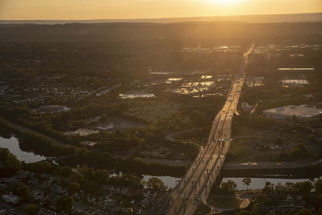 <p>Victor J. Blue/getty</p> Vehicles travel along Route 3 in Clifton, N.J. on Thursday June 17, 2021.