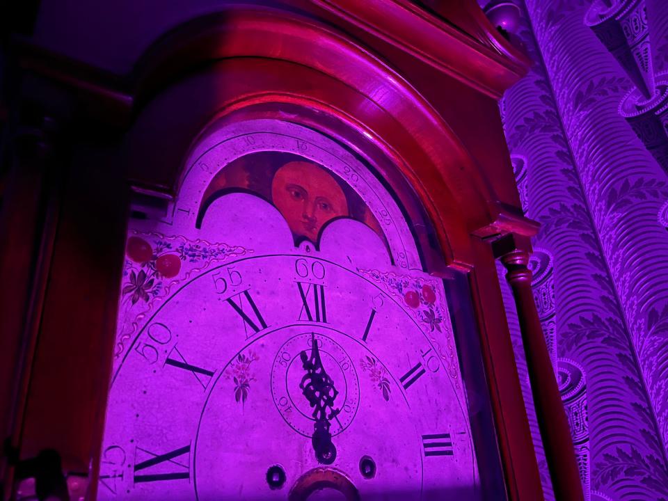 A clock with a face inside Morris-Jumel Mansion.