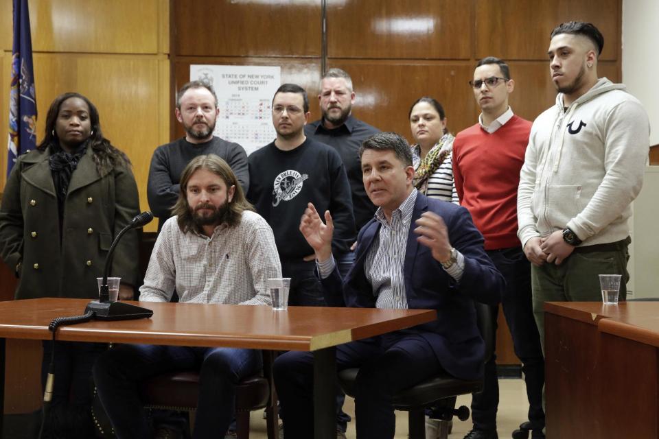 Tom Hoscheid, and Michael Castellon, foreground left and right, are joined by fellow jurors in the Pedro Hernandez case during a news conference, after their guilty verdict in Manhattan Supreme Court, Tuesday, Feb. 14, 2017, in New York. Hernandez, a former store clerk, was convicted Tuesday of murder in one of the nation's most haunting missing-child cases, the disappearance of 6-year-old Etan Patz on the way to the school bus stop 38 years ago.(AP Photo/Richard Drew)