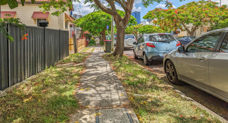 Cars parked along a city street. 