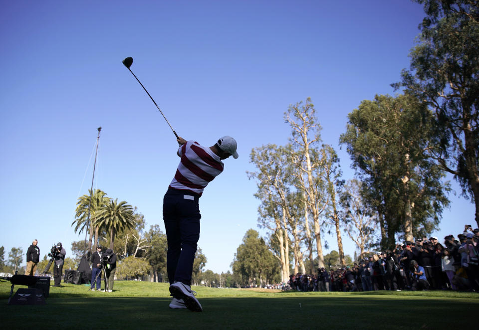 Rory McIlroy, of Northern Ireland, tees off on the 11th hole during the second round of the Genesis Invitational golf tournament at Riviera Country Club, Friday, Feb. 14, 2020, in the Pacific Palisades area of Los Angeles. (AP Photo/Ryan Kang)