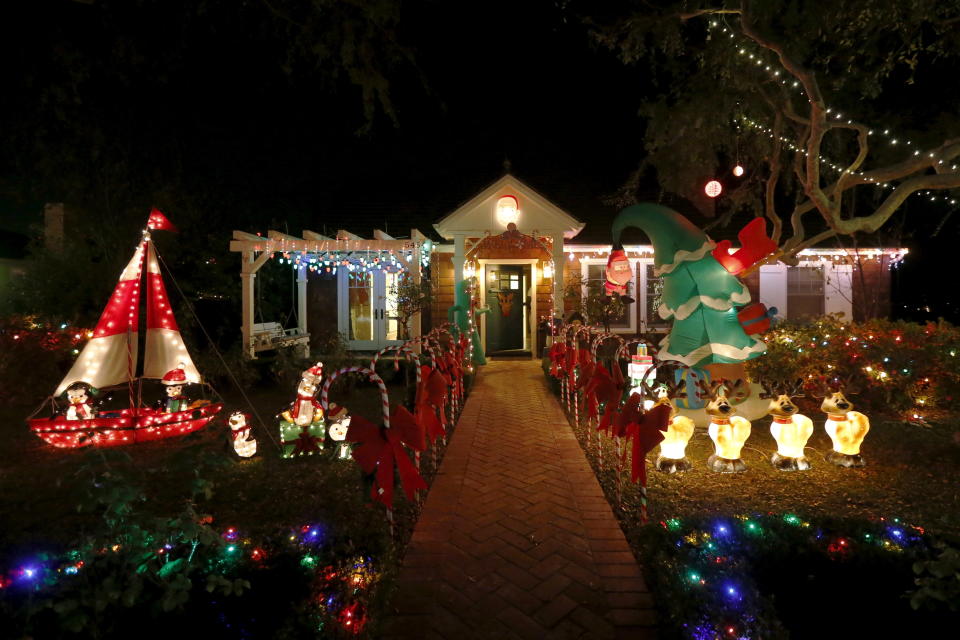 Christmas lights are seen on a home in the Sleepy Hollow area of Torrance, California, United States, December 15, 2015. In many neighborhoods of Los Angeles, homeowners compete for the most lavish and creative holiday light displays. Torrance's Sleepy Hollow is one such neighborhood where every home outdoes the next: surfing Santas, life-size nativity scenes, ferris wheels, and giant inflatable snowmen line the lawns on every street. Picture taken December 15, 2015.   REUTERS/Lucy Nicholson