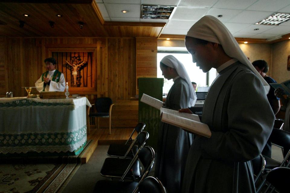 Catholic Mongolians pray during a Mass at St. Peter and St. Paul parish church in Ulan Bator, Mongolia. <a href="https://www.gettyimages.com/detail/news-photo/catholic-mongolians-pray-during-a-mass-at-st-peter-and-st-news-photo/2178763?adppopup=true" rel="nofollow noopener" target="_blank" data-ylk="slk:Oleg Nikishin/Getty Images;elm:context_link;itc:0;sec:content-canvas" class="link ">Oleg Nikishin/Getty Images</a>