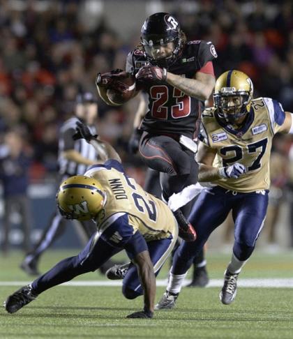 Jonathan Williams (22) ran all over Winnipeg Friday en route to a First Star selection. (Justin Tang/The Canadian Press.)