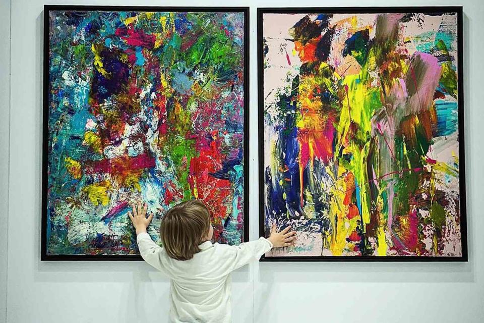 <p>Laurent Schwarz</p> Laurent Schwarz touching his paintings 