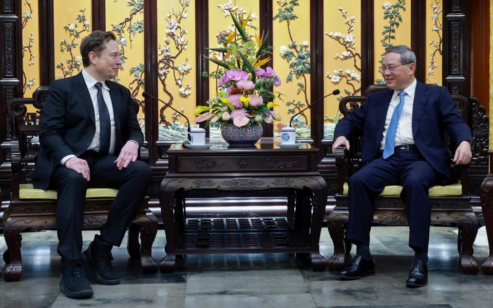 Elon Musk, Tesla chief executive, with Li Qiang, Chinese premier, in Beijing