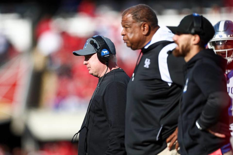 Kentucky coach Mark Stoops, left, led the Wildcats to a 38-31 upset of then-No. 10 Louisville on Saturday that gave UK its fifth straight victory over U of L in the Governor’s Cup rivalry.