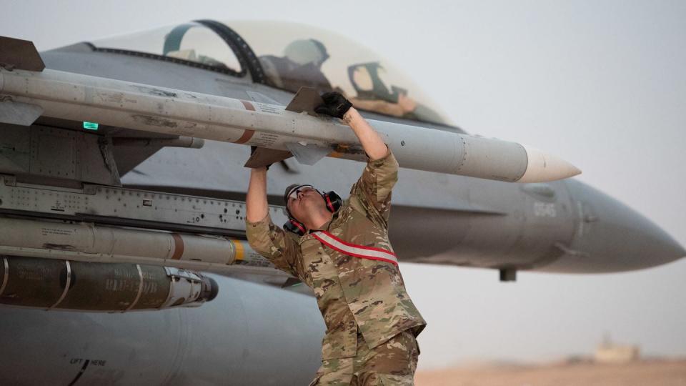U.S. Air Force Master Sgt. Dustin Flaspohler, 138th Fighter Wing aircraft armament systems specialist, performs weapons checks on an F-16 Fighting Falcon assigned to the 125th Expeditionary Fighter Squadron, after hot pit refueling at Prince Sultan Air Base, Saudi Arabia, Aug. 15, 2023. Hot pit refueling occurs after an aircraft has landed and is still running its engine allowing for refueling in austere locations. (U.S. Air Force photo by Tech. Sgt. Alexander Frank) 
