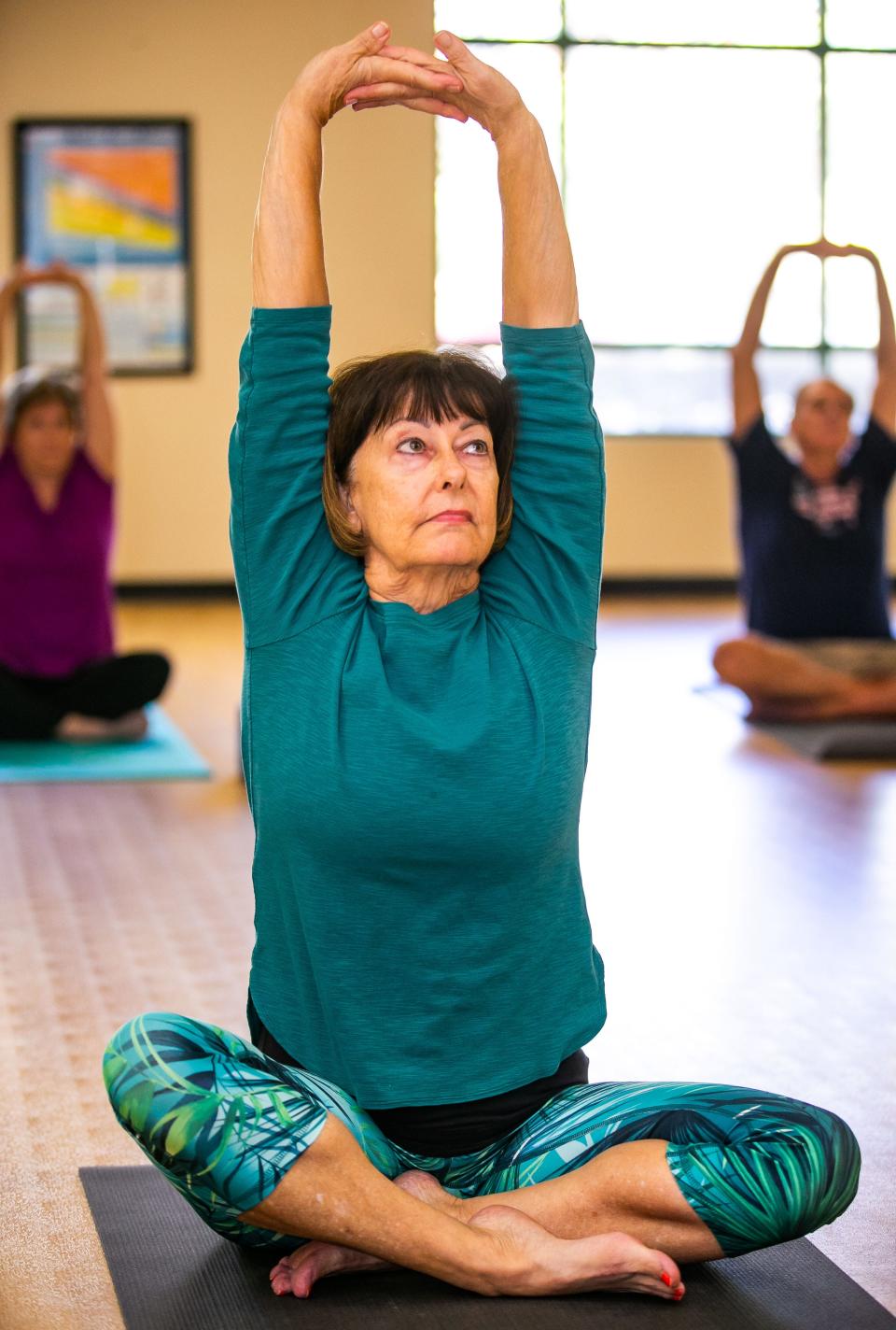 Linda Zimmerman, 71, of Summerfield, center, works out in Yoga class Wednesday afternoon, with her friends at Del Webb Spruce Creek in Summerfield. Zimmerman has chronic kidney disease and is in need of a transplant. Her current kidney function is around 11%.