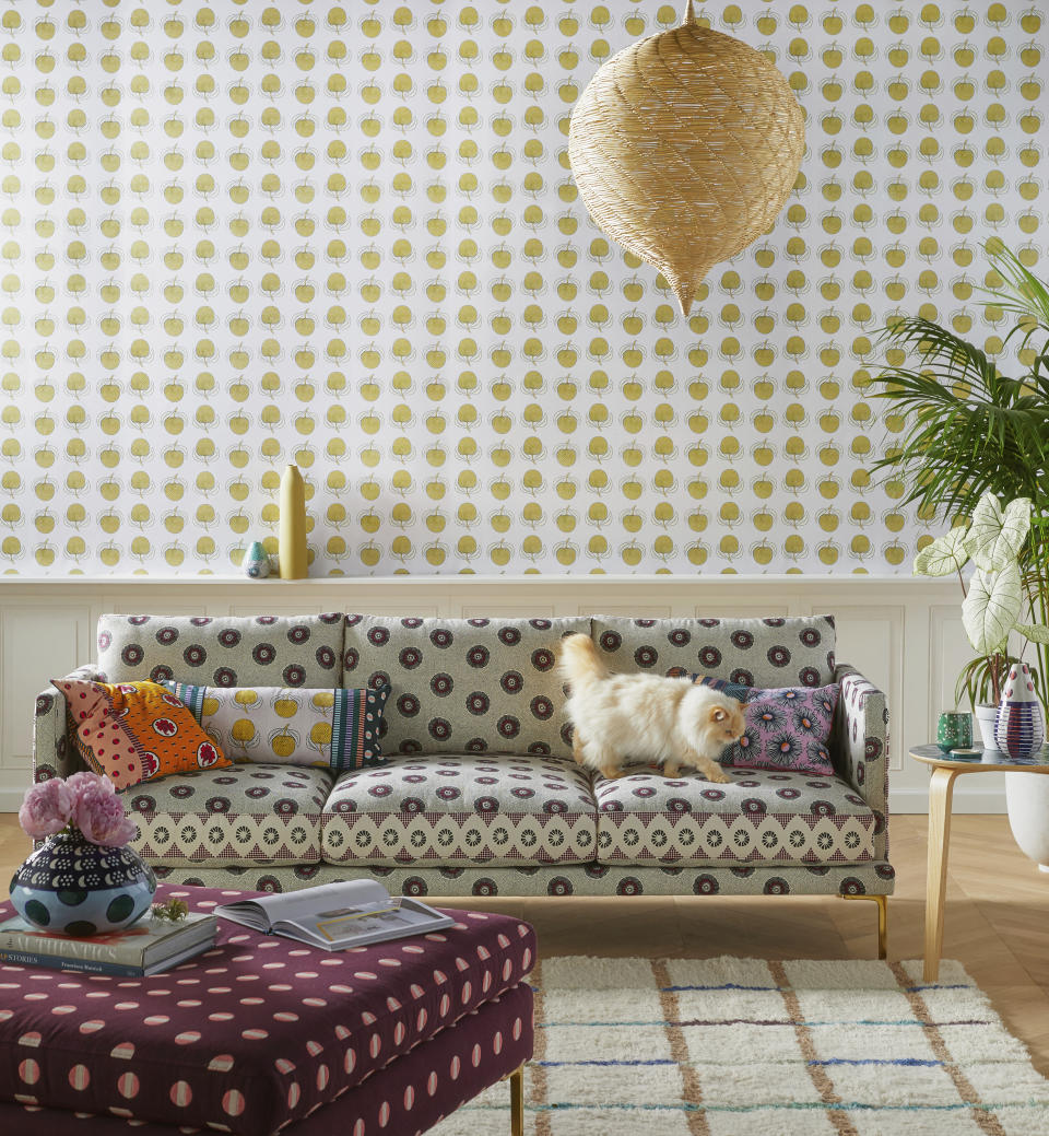 This undated photo provided by Anthropologie shows the Linde sofa, a collaborative collection with luxury lifestyle brand SUNO. Featuring a geometric print and cast iron legs, the sofa has a chic yet relaxed midmod Italian profile. (Anthropologie via AP)