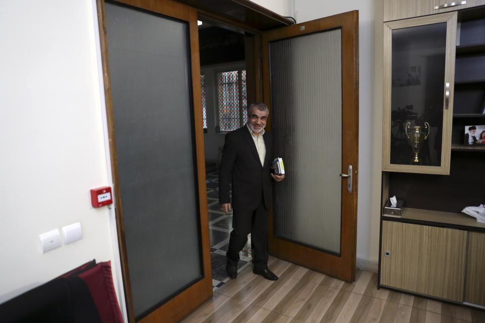 In this Nov. 9, 2019, photo, Abbas Ali Kadkhodaei, a prominent member of Iran's powerful Guardian Council, arrives for an interview with The Associated Press in, Tehran, Iran. A prominent member of Iran’s powerful Guardian Council has told The Associated Press that the Islamic Republic should stop honoring the terms of its collapsing 2015 nuclear deal with world powers amid tensions with the U.S. (AP Photo/Vahid Salemi)