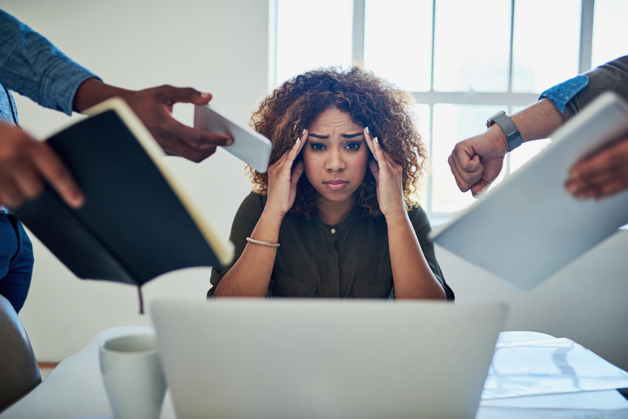 Shot of a stressed out young woman working in a demanding career false urgency Employers