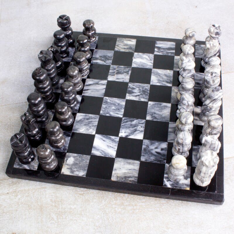 Made of marble, these chess pieces are a little more special than the ones in a standard chess set. <a href="https://fave.co/3lD0UjU" target="_blank" rel="noopener noreferrer">Find it for $77 at Wayfair</a>. 