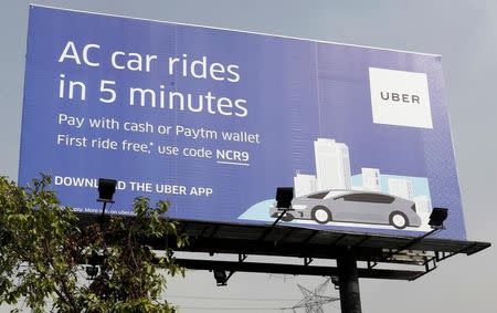 A billboard of ride-hailing service Uber is pictured on a highway in New Delhi, April 19, 2016. REUTERS/Anindito Mukherjee