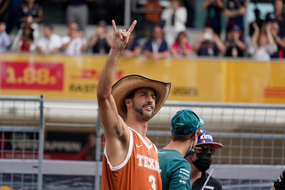 McLaren driver Daniel Ricciardo, of Australia, waves to fans before the Formula One U.S. Grand Prix auto race at the Circuit of the Americas