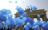 FILE Blue balloons with the slogan "Europa (Europe)" fly during an EU event in front of the Brandenburg Gate, in Berlin, one day before the enlargement of the European Union on Friday, April 30, 2004. Leaders from more than 40 countries will gather Thursday, Oct. 6, 2022, in Prague, to launch a "European Political Community" aimed at boosting security and economic prosperity across the continent, but critics claim the new forum is an attempt to put the brakes on European Union enlargement. (AP Photo/ Jan Bauer, File)