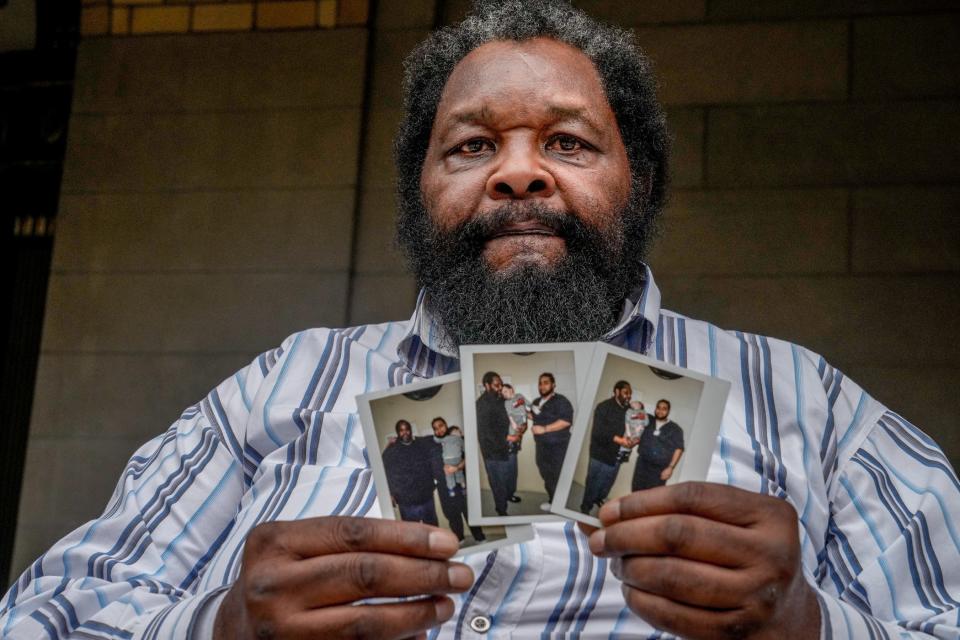 Melvin Spivey holds photos of his grandson Donovann Hall, taken during a visit with him in prison. Hall's conviction in a 2012 triple murder was overturned last winter, but he is still being held as a resolution is sought in his case.