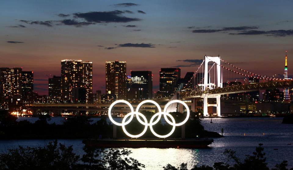 The Olympic Rings are seen in front of the skyline during sunset one night ahead of the official opening of the Tokyo 2020 Olympic Games in Tokyo, Japan, July 22, 2021.   REUTERS/Kai Pfaffenbach     TPX IMAGES OF THE DAY