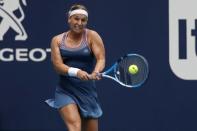 Mar 20, 2019; Miami Gardens, FL, USA; Dominika Cibulkova of Slovakia hits a backhand against Victoria Azarenka of Belarus (not pictured) in the first round of the Miami Open at Miami Open Tennis Complex. Geoff Burke