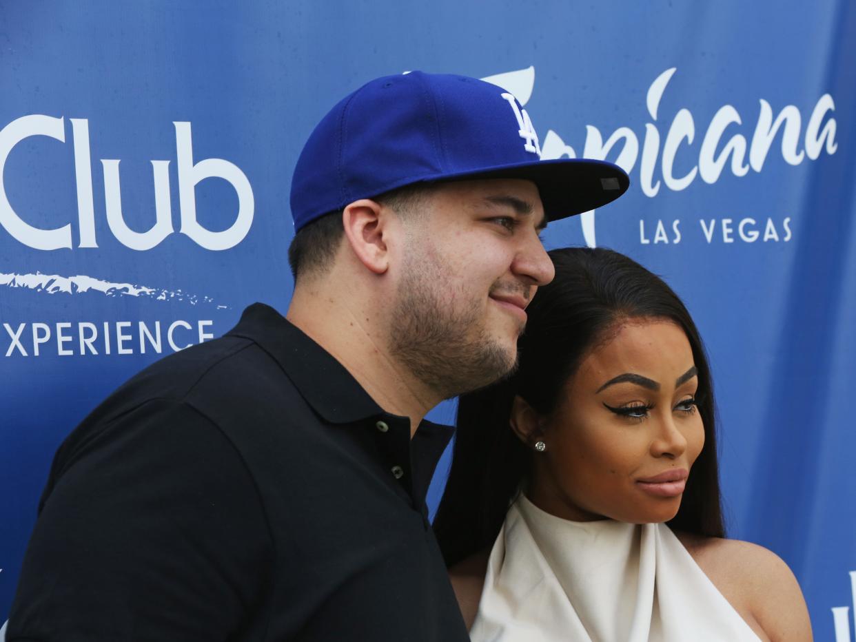 Rob Kardashian and Blac Chyna pose for a photo.