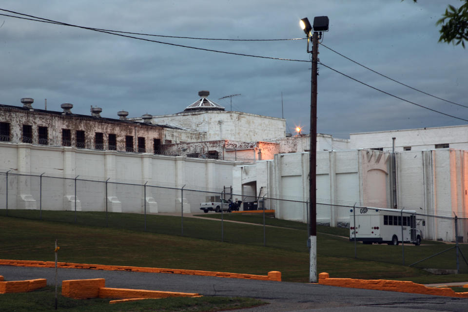 This April 29, 2014 photo shows the Oklahoma State Penitentiary in McAlester, Okla. after Robert Patton stopped the execution of Clayton Lockett. Lockett died 43 minutes after his execution began Tuesday night as Oklahoma used a new drug combination for the first time in the state. Autopsy results are pending but state prison officials say Lockett apparently suffered a massive heart attack. (AP Photo/Tulsa World, John Clanton) KOTV OUT; KJRH OUT; KTUL OUT; KOKI OUT; KQCW OUT; KDOR OUT; TULSA OUT; TULSA ONLINE OUT