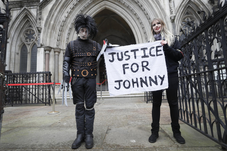 <p>Johnny Depp supporters hold a banner outside the High Court in London, Thursday, March 18, 2021. Johnny Depp's bid to overturn a damning ruling that he assaulted his ex-wife Amber Heard and put her in fear for her life will be considered by the Court of Appeal on Thursday.(AP Photo/Kirsty Wigglesworth)</p>
