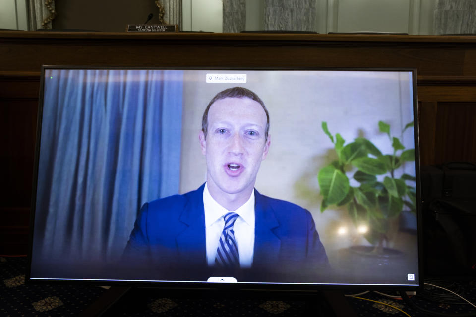 Facebook CEO Mark Zuckerberg appears on a screen as he speaks remotely during a hearing before the Senate Commerce Committee on Capitol Hill, Wednesday, Oct. 28, 2020, in Washington. The committee summoned the CEOs of Twitter, Facebook and Google to testify. (Michael Reynolds/Pool via AP)