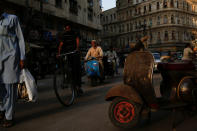 <p>A man rides a Vespa scooter on a busy street, in a low-income neighbourhood in Karachi, Pakistan on March 6, 2018. (Photo: Akhtar Soomro/Reuters) </p>