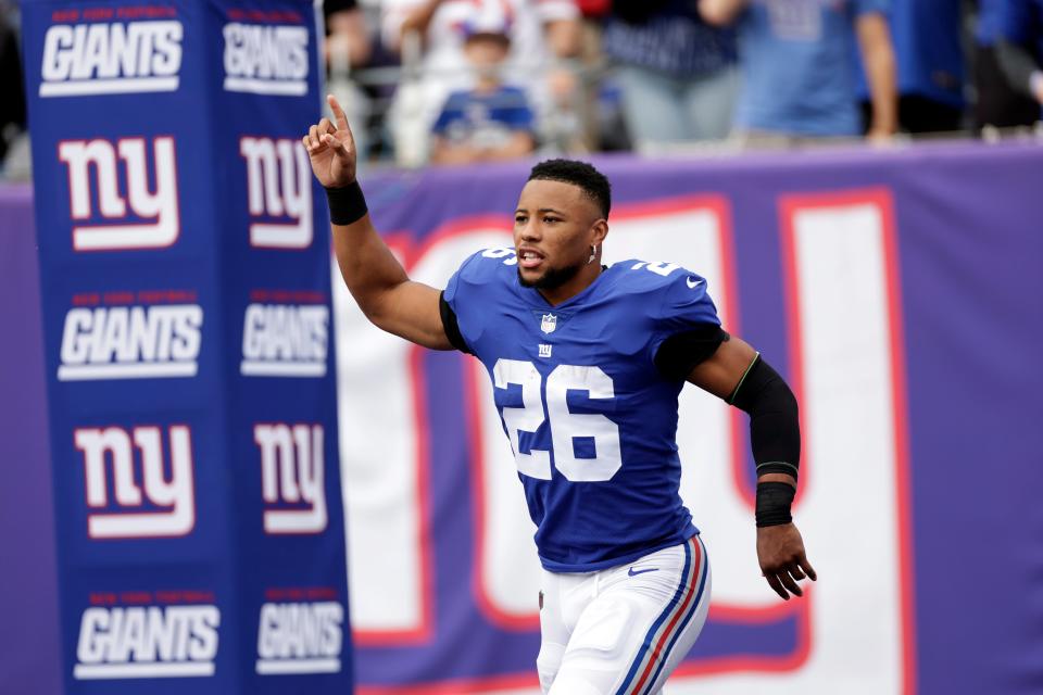 New York Giants running back Saquon Barkley (26) takes the field against the Baltimore Ravens during an NFL football game Sunday, Oct. 16, 2022, in East Rutherford, N.J. (AP Photo/Adam Hunger)