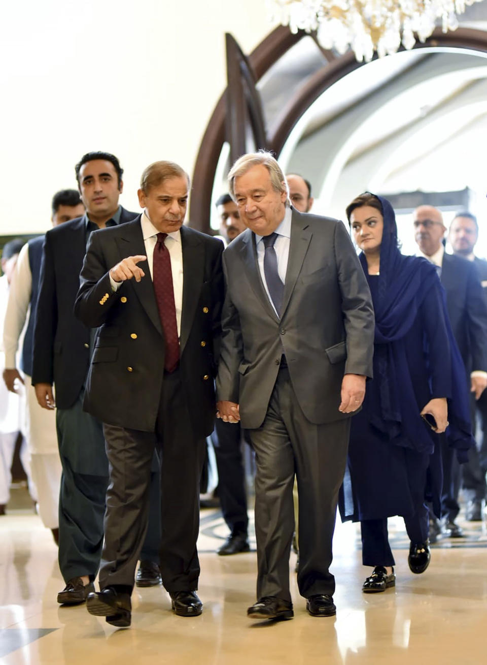 In this handout photo released by Pakistan Prime Minister Office, Prime Minister Shahbaz Sharif, left, receives U.N. Secretary-General Antonio Guterres at the Prime Minister House in Islamabad, Pakistan, Friday, Sept. 9, 2022. Guterres appealed to the world to help Pakistan after arriving in the country Friday to see climate-induced devastation from months of deadly record floods that have left half a million people living in tents under the open sky. (Pakistan Prime Minister Office via AP)