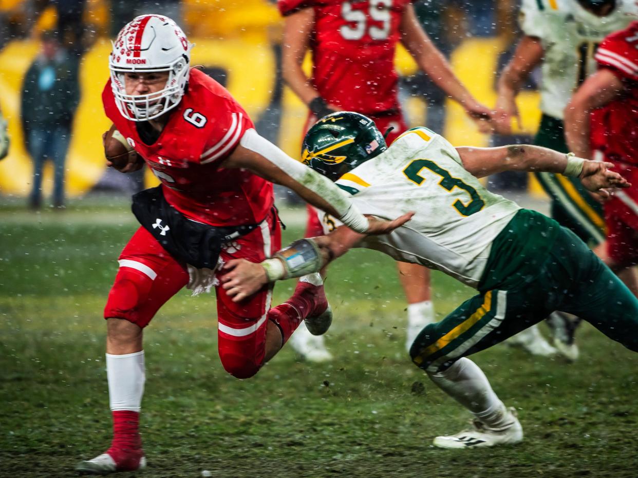 Moon's Tyler McGowan runs for yards against Penn-Trafford during the WPIAL 5A Championship Saturday at Heinz Field.