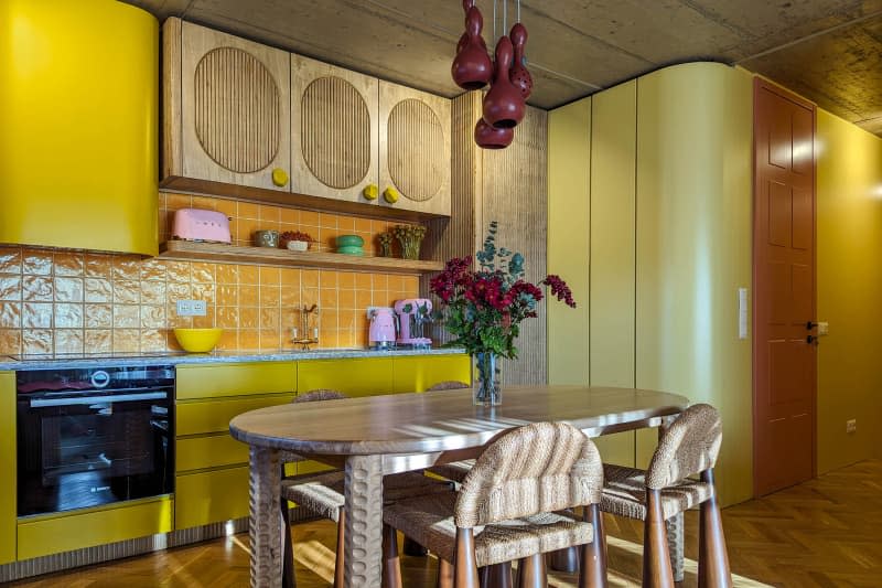 Floral arrangement on dining table in vintage inspired home.