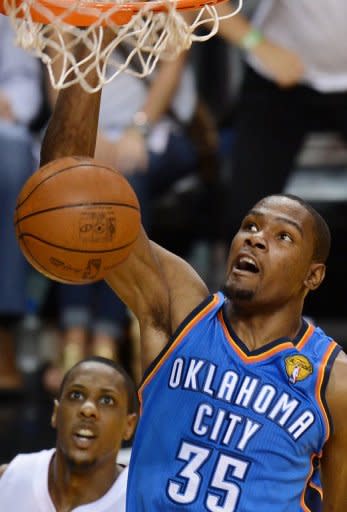 Kevin Durant of the Oklahoma City Thunder scores during the fifth game of the NBA Finals at the American Airlines Arena in Miami, Florida. The Miami Heat won the NBA Finals, defeating the Oklahoma City Thunder 121-106 to capture the best-of-seven championship series 4-1