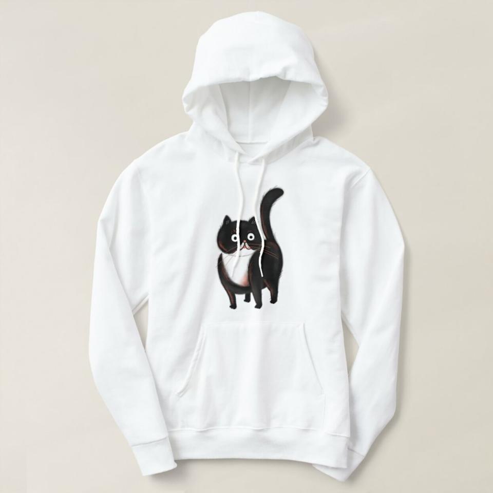 Product photo of a Little Black Cat Hoodie on a tan background