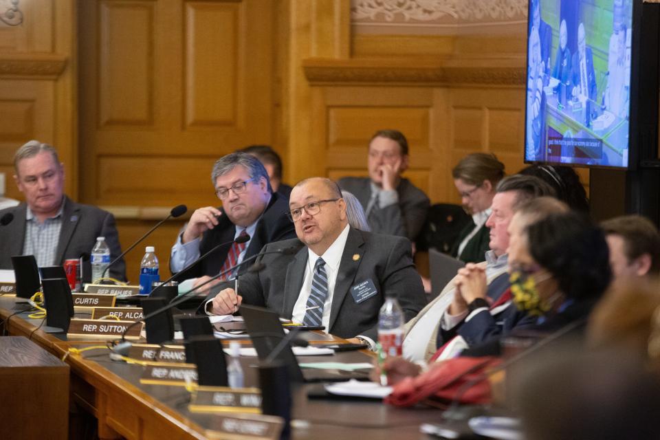 Rep. John Alcala, D-Topeka, middle, agrees about state employees needing higher wages as proposed by Gov. Laura Kelly's budget director Adam Proffitt at Thursday's committee hearing.