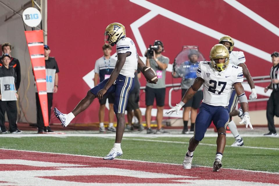 Akron quarterback DJ Irons celebrates a touchdown run against Indiana on Sept. 23 in Bloomington.