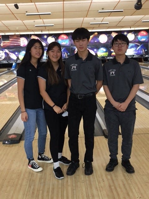 Fort Lee girls bowling starters Katelyn Lee (left) and Michelle Kim (second from left), shown with 2021-22 boys captains Nathan Yong and Daniel Kim, return to help the Lady Bridgewomen defend their Big North American Division title.