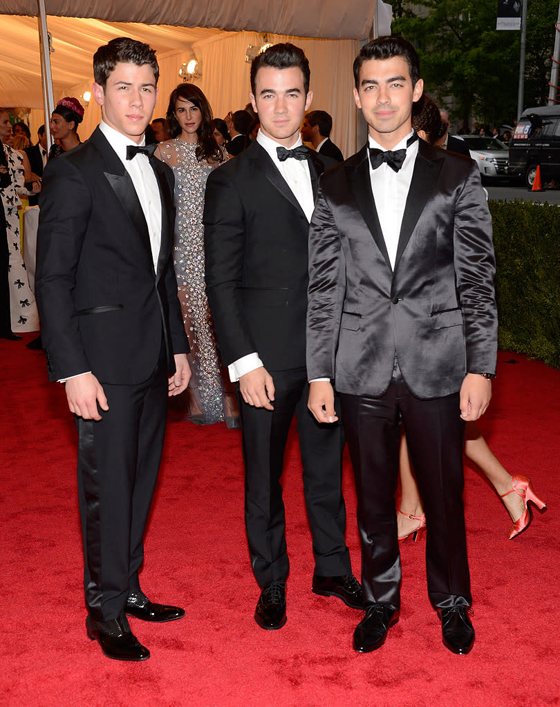  <p class="MsoNormal"><span>One of these brothers is not like the others! Joe Jonas (right) stood out in this trio of JoBros thanks to his satin Calvin Klein tuxedo, while Nick (left) and Kevin kept things more subdued. </span></p>