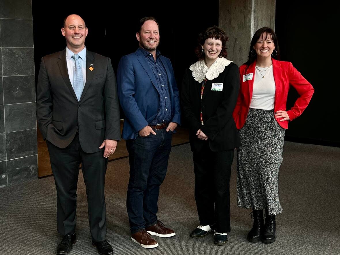 The provincial government announced funding on Monday for a Youth Climate Council that will advise it on environmental policy. From left, Environment Minister Tim Halman, Clean Foundation CEO Scott Skinner,  youth council member Jude Sampson and Lauren Murphy, director of workforce development with Clean Foundation. (Kathleen McKenna/CBC - image credit)