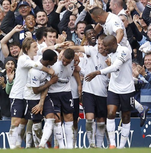 Tottenham Hotspur's Kyle Walker (C) celebrates after scoring a goal during an English Premier League football match between Tottenham Hotspur and Blackburn Rovers at White Hart Lane in London. Tottenham Hotspur revived their bid for Champions League football by returning to the top four of the Premier League with a 2-0 win