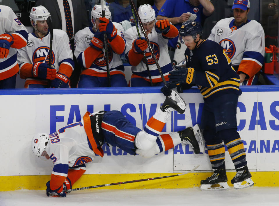 Buffalo Sabres forward Jeff Skinner (53) and New York Islanders forward Cal Clutterbuck (15) collide during the third period of an NHL hockey game, Monday, Dec. 31, 2018, in Buffalo N.Y. (AP Photo/Jeffrey T. Barnes)