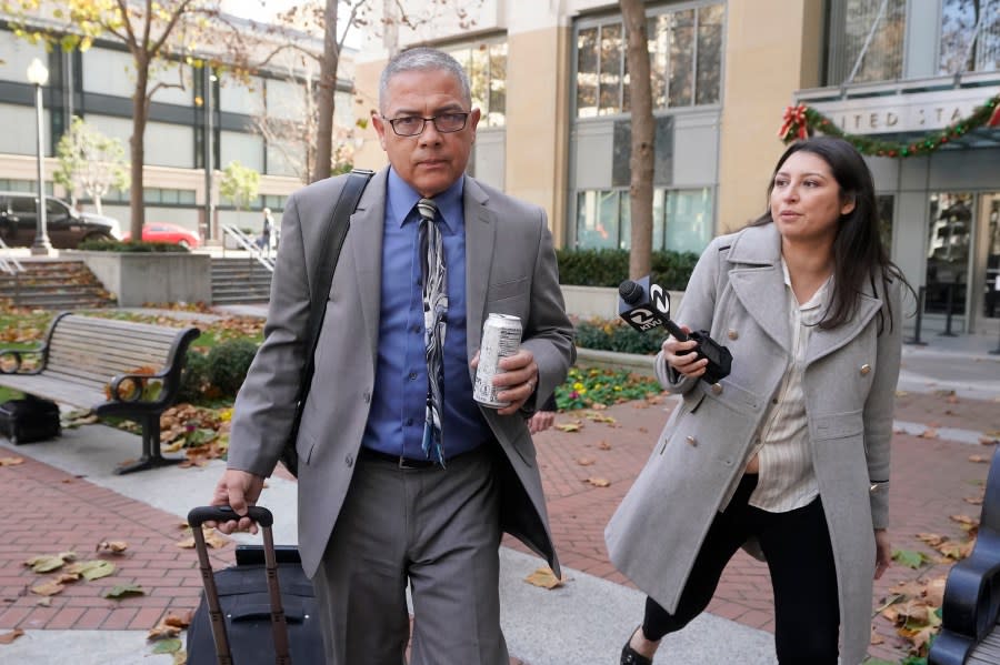 Ray J. Garcia, the former warden of a federal women’s prison, leaves a courthouse in Oakland on Nov. 28, 2022. (AP Photo/Jeff Chiu)