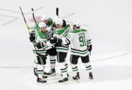 Dallas Stars' Joe Pavelski (16) celebrates his goal with teammates during second-period NHL Stanley Cup finals hockey action against the Tampa Bay Lightning in Edmonton, Alberta, Monday, Sept. 21, 2020. (Jason Franson/The Canadian Press via AP)