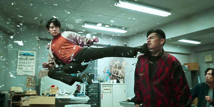 A man floating in air kicks another man in the face in City Hunter.