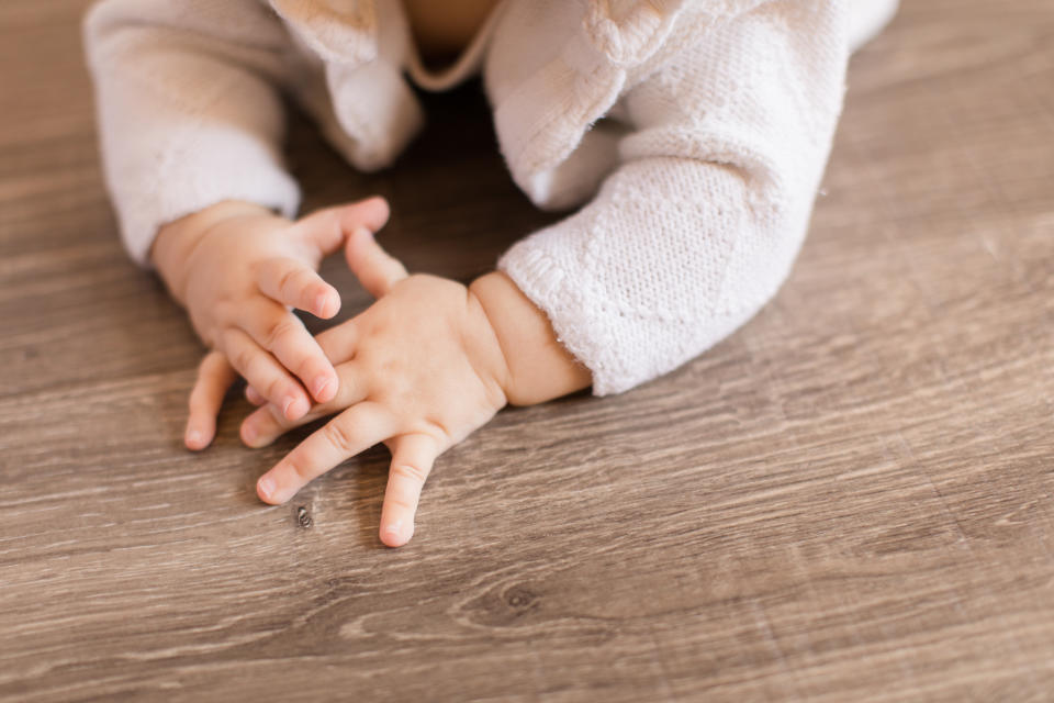 A closeup photo of a 11-week old baby girl's hands.