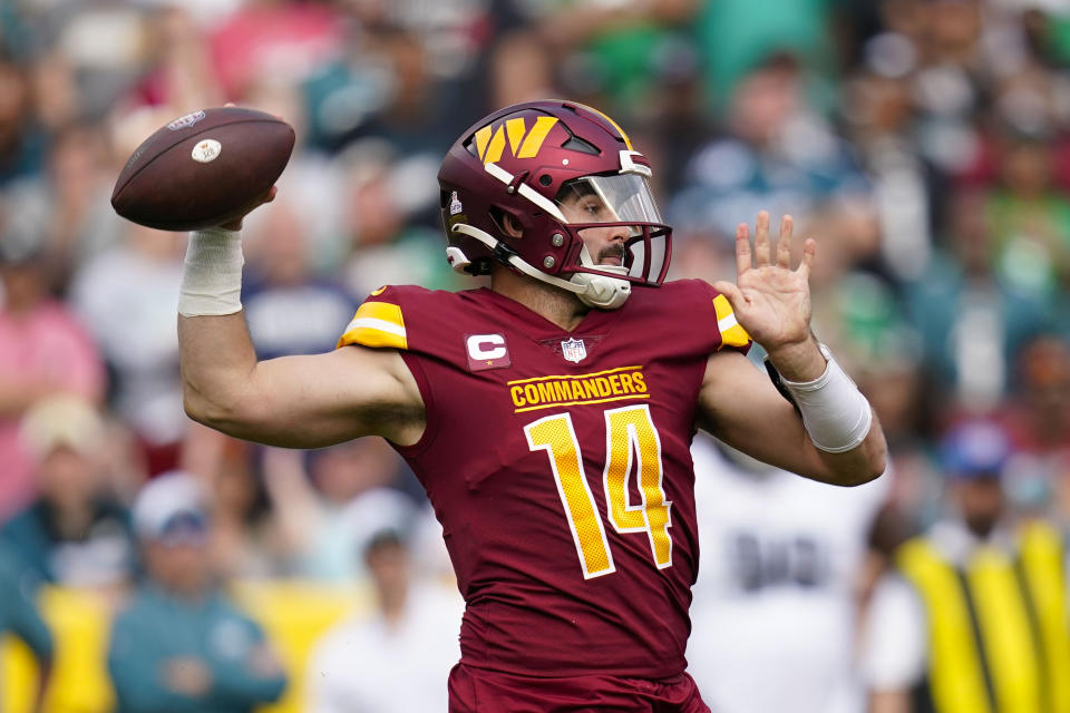 Washington Commanders quarterback Sam Howell (14) throws the ball during the second half of an NFL football game against the Philadelphia Eagles, Sunday, Oct. 29, 2023, in Landover, Md. (AP Photo/Stephanie Scarbrough)