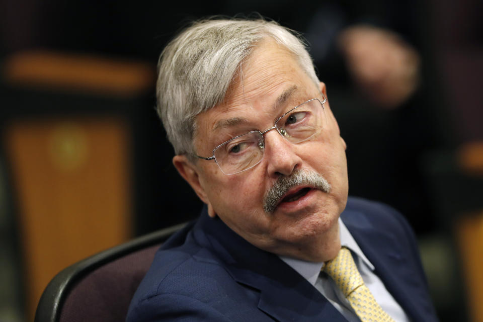 U.S. Ambassador to China Terry Branstad listens to Secretary of State Mike Pompeo speak to the Future Farmers of America and Johnston High School students, Monday, March 4, 2019, in Johnston, Iowa. (AP Photo/Charlie Neibergall)