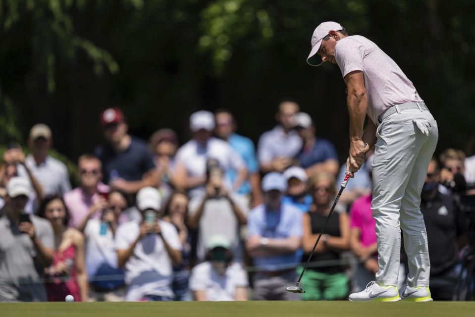 Rory McIlroy watches his putt on the third hole during the fourth round of the Wells Fargo Championship golf tournament at Quail Hollow on Sunday, May 9, 2021, in Charlotte, N.C. (AP Photo/Jacob Kupferman)