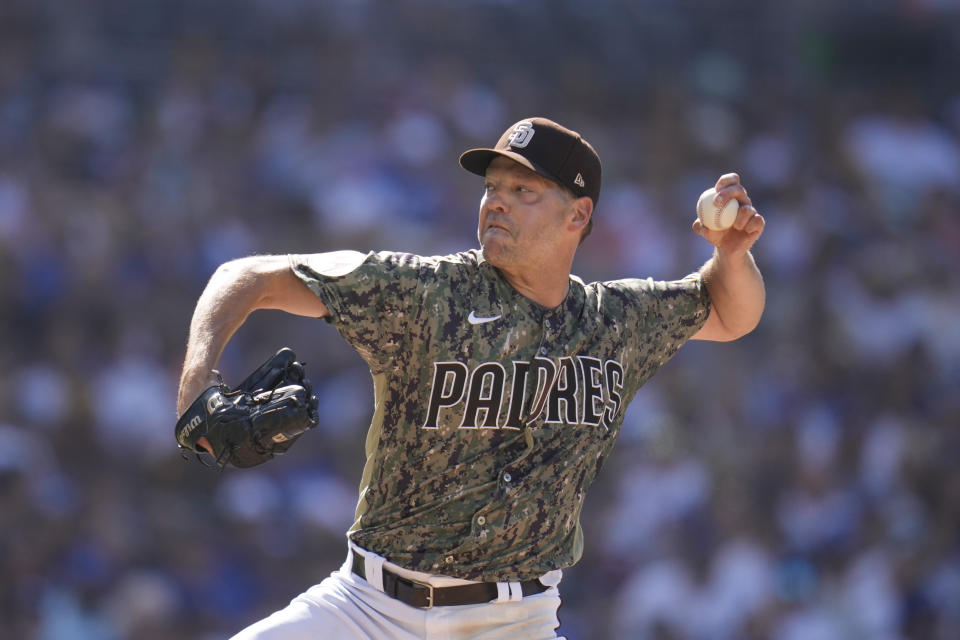 San Diego Padres starting pitcher Rich Hill works against a Los Angeles Dodgers batter during the second inning of a baseball game Sunday, Aug. 6, 2023, in San Diego. (AP Photo/Gregory Bull)